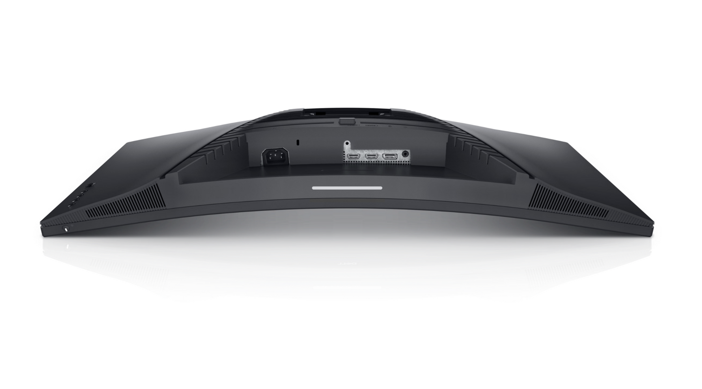 The Dell S3222DGM is Laid with the Screen facing down which shows the curvature of the screen. There is a power button on the lower left hand edge of the screen. The ports below the stand slot from left to right are; Kettle lead connection, HDMI, HDMI. Display Port, Audio line out. There is an edgelight on the lower centre edge of the screen.