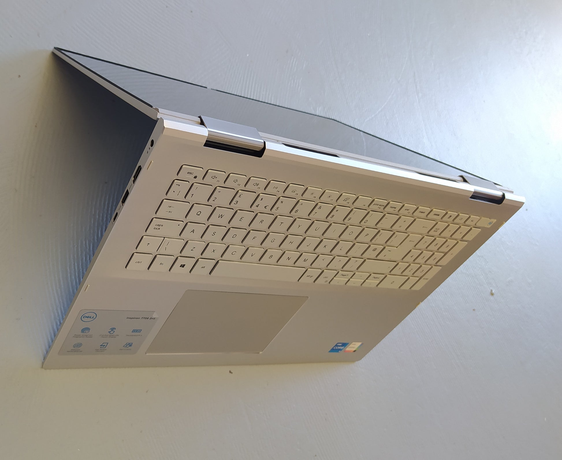 Tent mode of the Dell Inspiron 7706 - A platinum silver 2in1 laptop with 17 Inch screen and native 2560 x 1600 Resolution. Featuring Windows 11 and an 11th gen intel processor. Connect easily via USB-C (Thunderbolt), USB 3.2 and HDMI. Hosting a GeForce MX350 Graphics Card. 77061165G716GB512SSDMX350